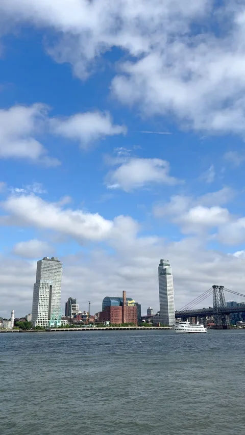 Cumulus Clouds over Williamsburg Skyline from East River Park in NYC Stock Footage 343800020