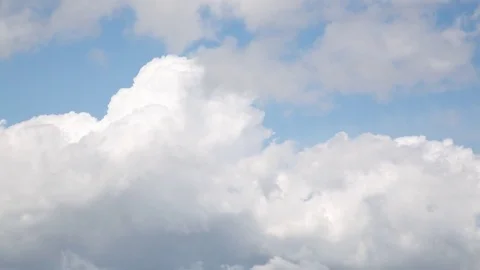 Cumulus Clouds Passing Across a Blue Sky Video stock 76853372
