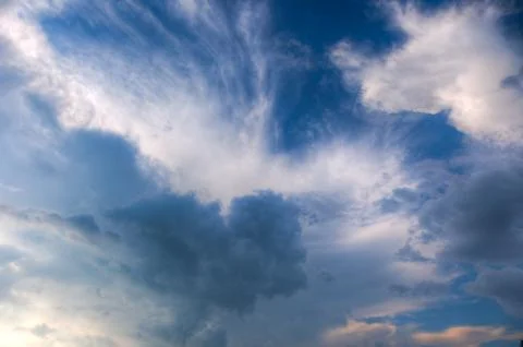 Cumulus clouds with rays of sun Stock Photos