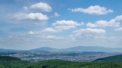 Cumulus clouds rolling over big city time lapse Stock Footage 69158226