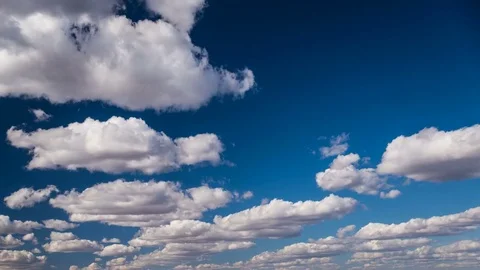 Cumulus Clouds rolling over blue sky Cloudscape Time-Lapse Video stock 73777727