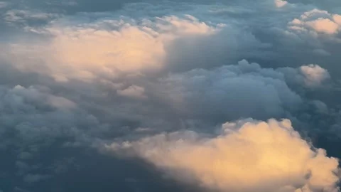 Cumulus clouds in the sky at sunset, creating a serene afterglow on the horizon Stock Footage 280146060