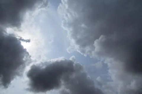 Cumulus clouds soaring high in the blue sky Stock Photos