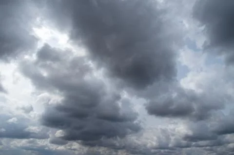 Cumulus clouds soaring high in the blue sky Stock Photos