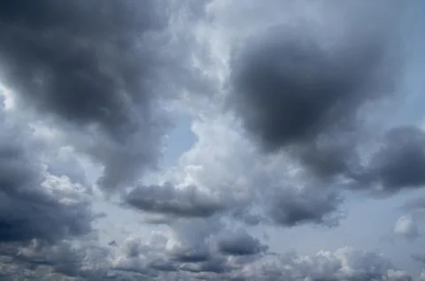 Cumulus clouds soaring high in the blue sky Stock Photos