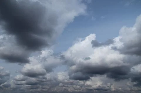 Cumulus clouds soaring high in the blue sky Foto stock