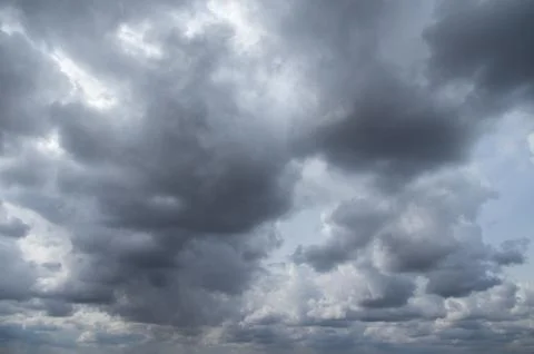 Cumulus clouds soaring high in the blue sky Stock Photos