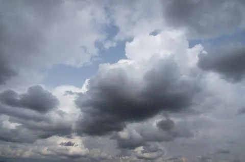 Cumulus clouds soaring high in the blue sky Stock Photos