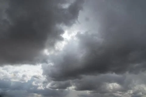 Cumulus clouds soaring high in the blue sky Stock Photos
