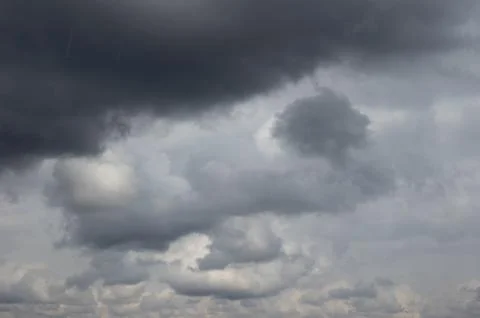 Cumulus clouds soaring high in the blue sky Stock Photos
