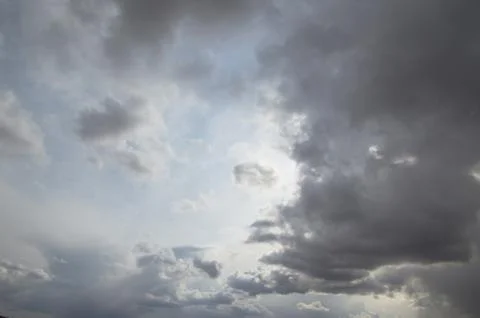 Cumulus clouds soaring high in the blue sky Stock Photos