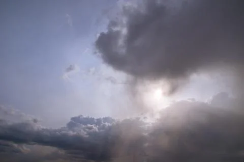 Cumulus clouds soaring high in the blue sky Stock Photos