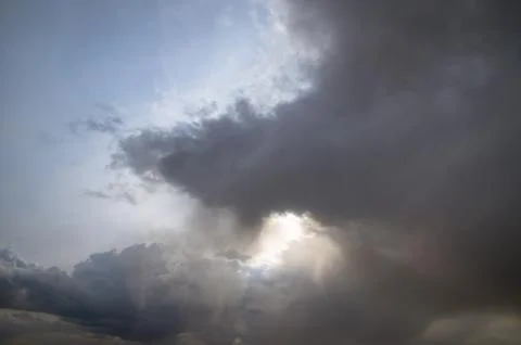 Cumulus clouds soaring high in the blue sky Stock Photos