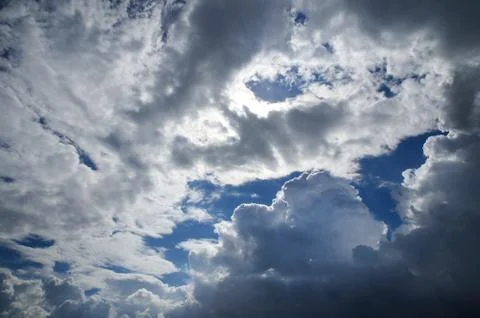 Cumulus clouds soaring high in the blue sky Stock Photos
