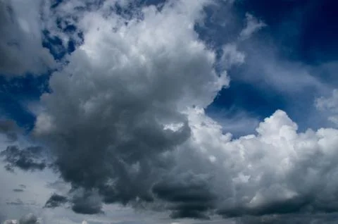 Cumulus clouds soaring high in the blue sky Stock Photos