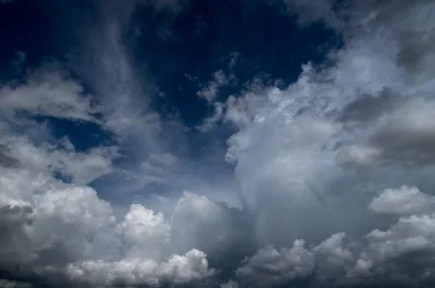 Cumulus clouds soaring high in the blue sky Stock Photos