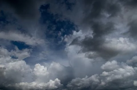 Cumulus clouds soaring high in the blue sky Stock Photos