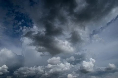 Cumulus clouds soaring high in the blue sky Stock Photos