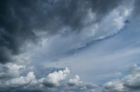 Cumulus clouds soaring high in the blue sky Stock Photos