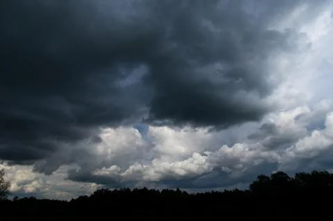 Cumulus clouds soaring high in the blue sky Stock Photos