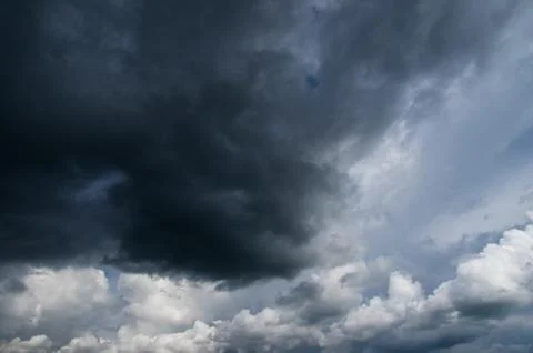 Cumulus clouds soaring high in the blue sky Stock Photos