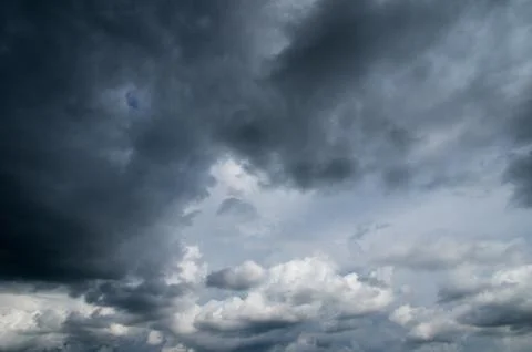 Cumulus clouds soaring high in the blue sky Stock Photos