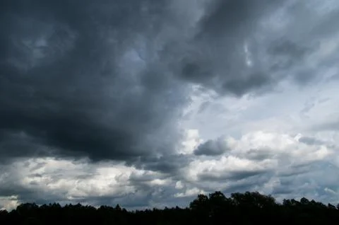 Cumulus clouds soaring high in the blue sky Stock Photos