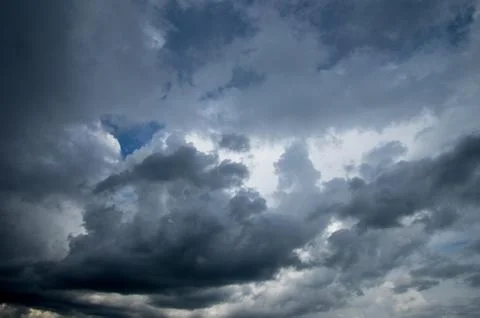 Cumulus clouds soaring high in the blue sky Stock Photos