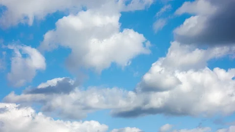 Cumulus clouds at spring day light in second full-frame time lapse Stock Footage 194424530