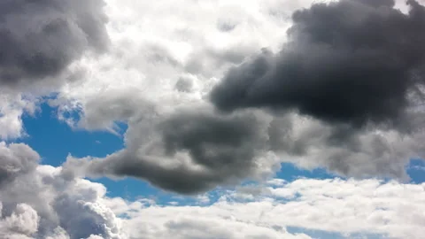 Cumulus clouds at spring day light in second full-frame time lapse Stock Footage 195442218