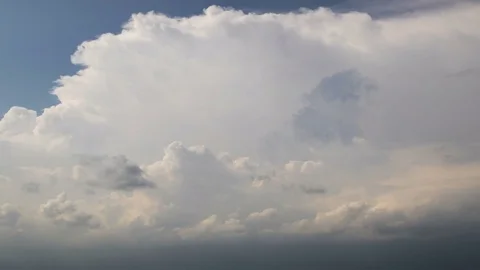 Cumulus clouds with sun rays, dramatic sky, time-lapse 4K. Stock Footage