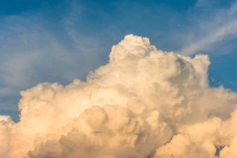 Cumulus clouds at sunset with gradient sky. Stock Photos