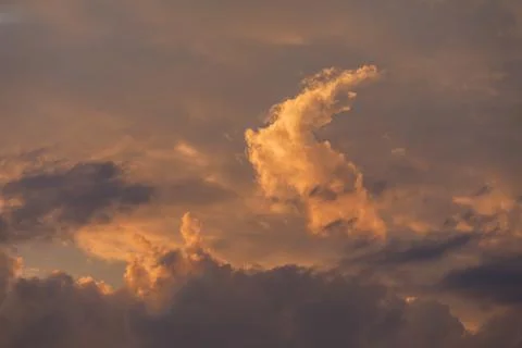 Cumulus clouds at sunset Stock Photos