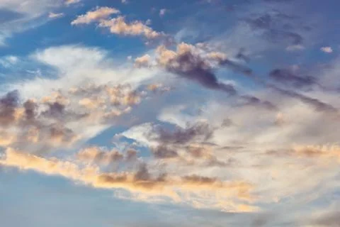 Cumulus clouds on sunset sky background Foto stock