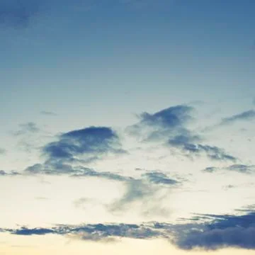 Cumulus clouds of the sunset with the sunset Blue sky blurred background defo Stock Photos