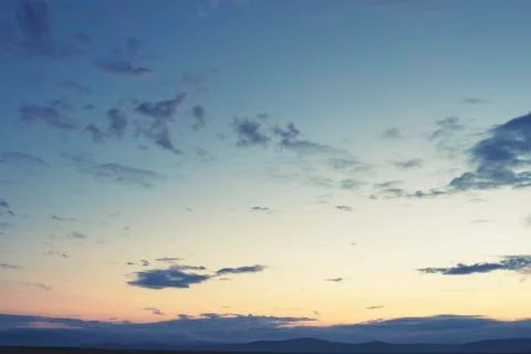 Cumulus clouds of the sunset with the sunset Blue sky blurred background defo Stock Photos