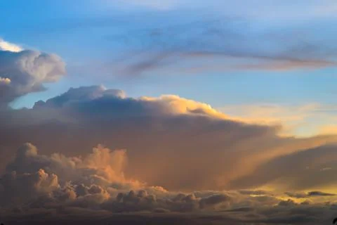 Cumulus clouds on sunset time, cloudscape Stockfoto's
