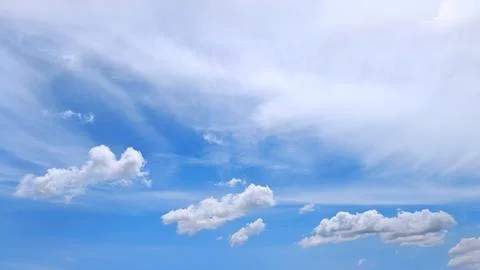 Cumulus Clouds under Cirrus Layers Stock Photos
