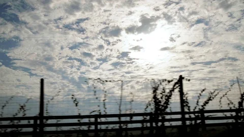 Cumulus clouds while driving Stock Footage 109591734