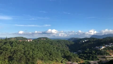 Cumulus rolling clouds timelapse in Dalat, Vietnam's honeymoon capital Stock Footage 154253211