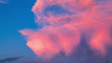 Cumulus Storm Clouds Turn Red Orange and then Blue at Sunset Time Lapse Stock Footage 279999034