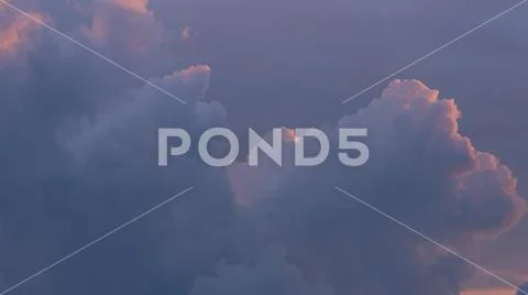 Cumulus type clouds on sunset. Stock Photos