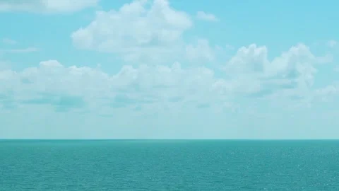 Cumulus White Clouds in Blue Sunny Sky Blue Turquoise Sea Time Lapse. Sunny Blue Video stock 312256352