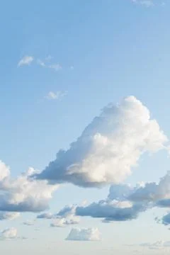 Cumulus white clouds floating on blue sky in beautiful morning.Sunny weather Stock Photos