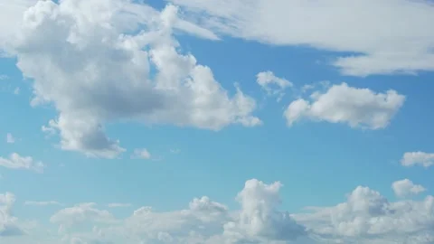 Cumulus White Clouds Fly Across a Bright Blue Sky. Clear Sky at Sunny Summer Aft Stock Footage 161245972