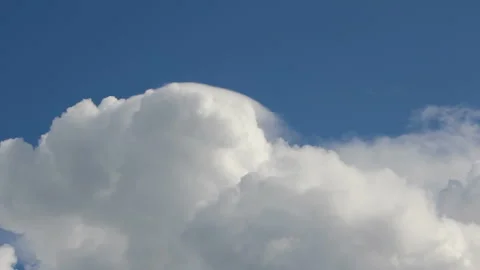 Cumulus white fluffy clouds float against the blue sky Stock Footage 280717510
