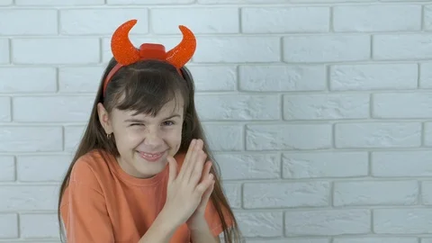 A cunning child with devil horns. Stock Footage 112625923