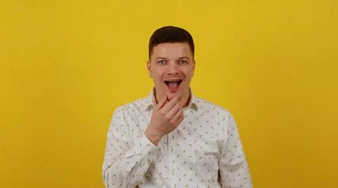 A cunning young guy in a shirt is plotting or inventing something. I got an idea Stock Photos