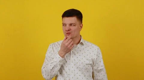 A cunning young guy in a shirt is plotting or inventing something. I got an idea Foto stock