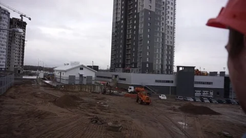 Cunstruction worker watching building process Stock Footage 69806385